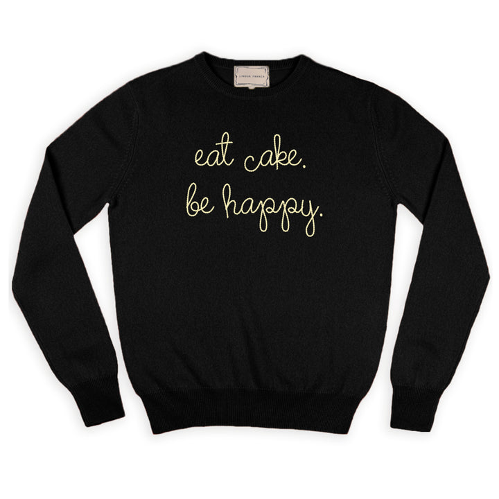 A black cashmere sweater chain-stitched in cream with the words eat cake. be happy.