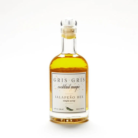 Gris Gris Jalapeno Hex simple syrup in a 13 oz glass bottle with a cork stopper