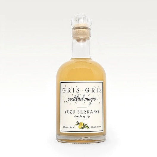 Gris Gris Yuzu Serrano simple syrup in a 13 oz glass bottle with a cork stopper